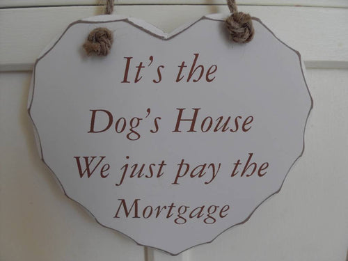 its the dogs house hear plaque we just pay the mortgage