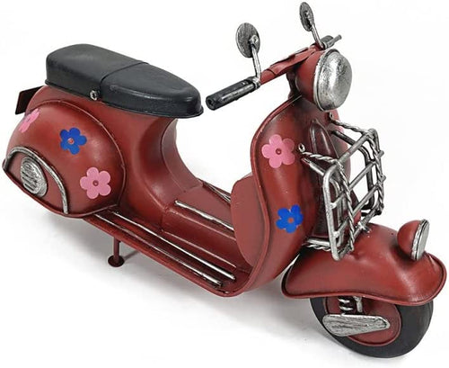 Red tin scooter with sticker in the shape of a