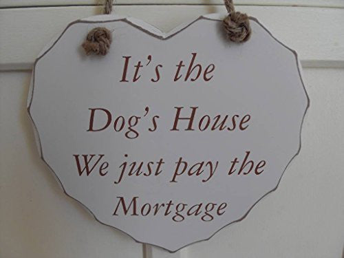 its the dogs house hear plaque we just pay the mortgage