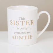 English porcelain mug with inscription "This Sister is being promoted to Auntie"