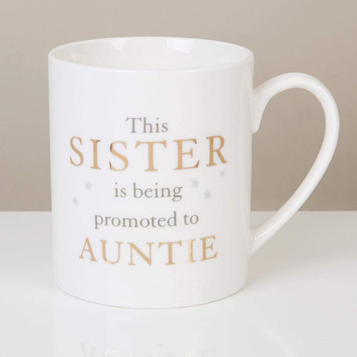 English porcelain mug with inscription "This Sister is being promoted to Auntie"