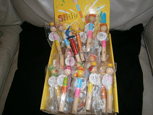 slide clown whistle various colours/faces one supplied