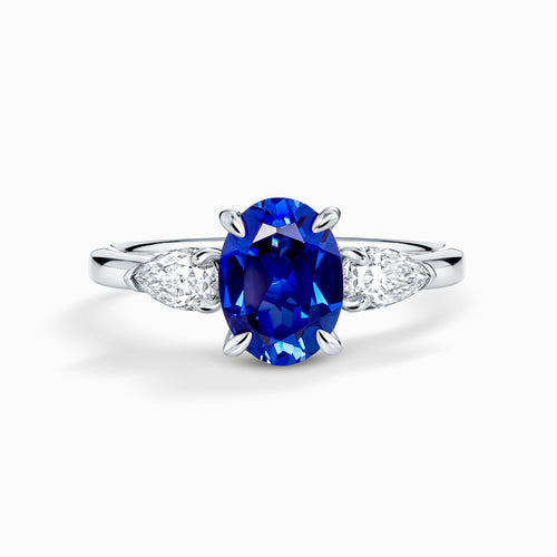 Blue Sapphire Oval Cut Three Stone Engagement Ring in Sterling Silver