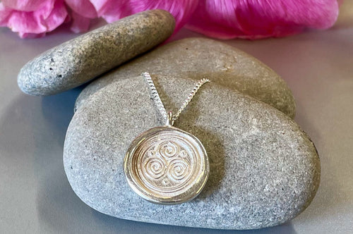 Symbolic Silver Pendants