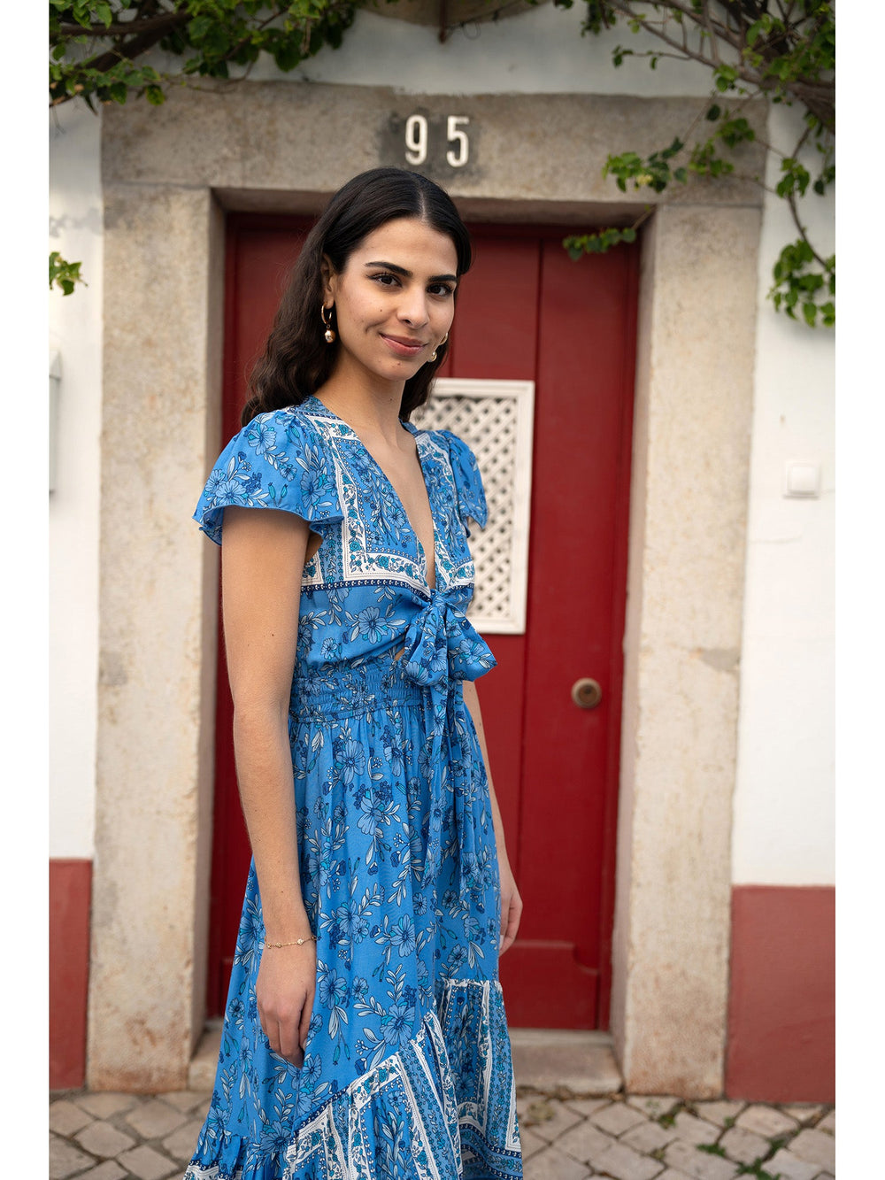 Mela Blue Ditsy Print Sun Dress With Cross Over Back Tie Front And Dip Hem