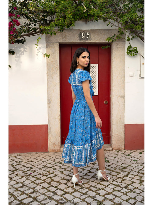 Mela Blue Ditsy Print Sun Dress With Cross Over Back Tie Front And Dip Hem